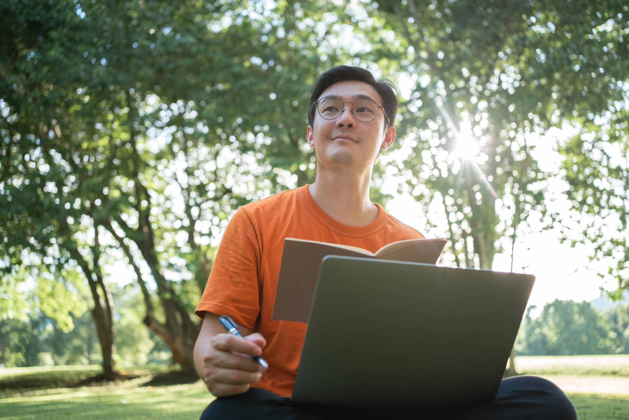 Mature man learning online and taking notes—committed to growth